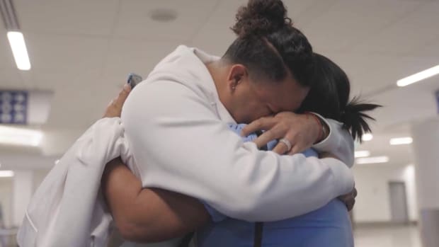 Dodgers reliever Brusdar Graterol hugs his mother in the airport.